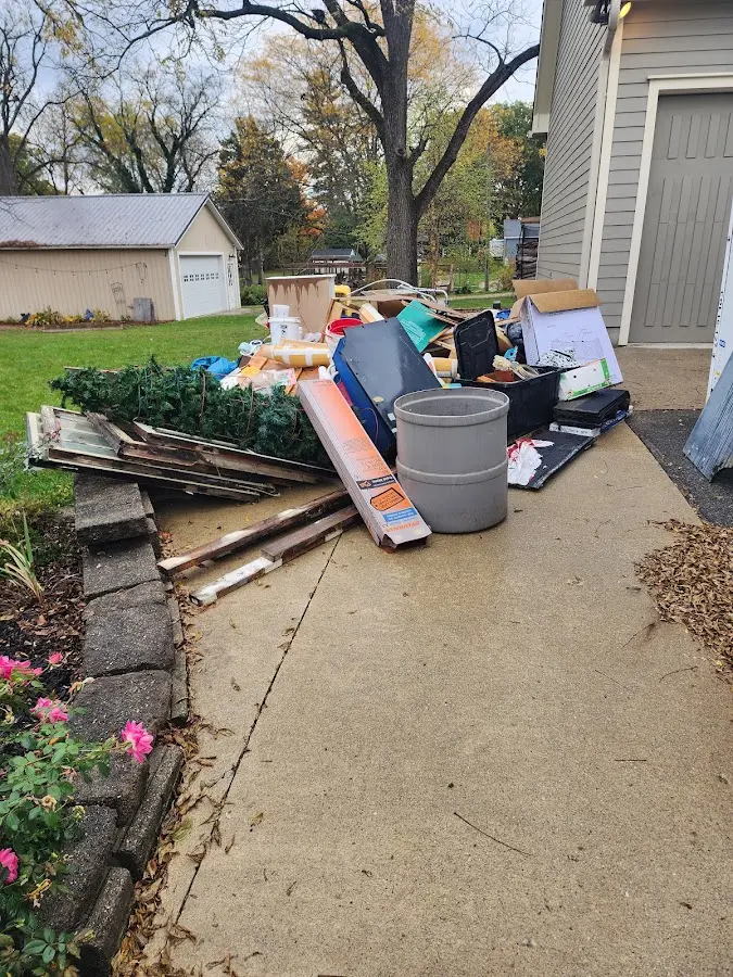 Dumpster being loaded with debris for Residential Dumpster Rental in Waterbury